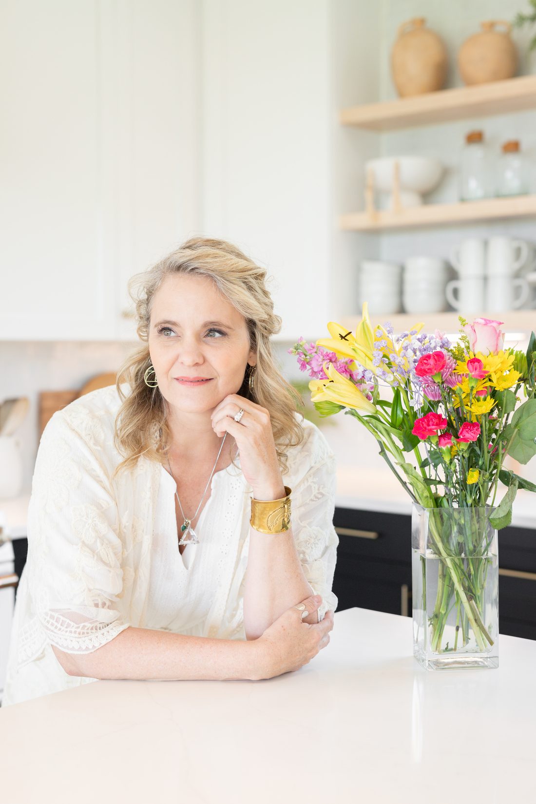 Dr. Amy with a vase of fresh flowers